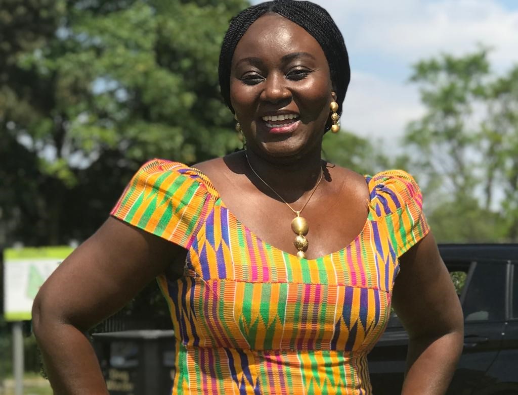 Cynthia wearing the Kente cloth